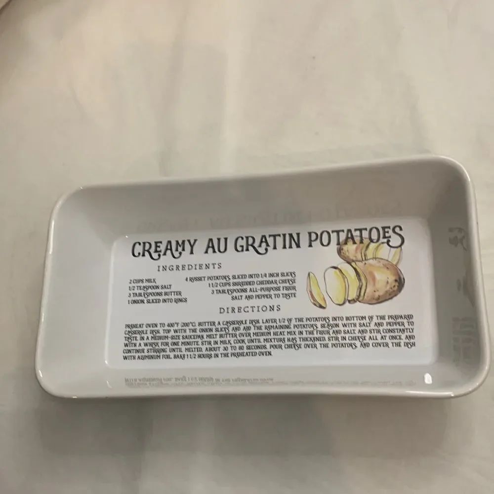 Creamy Au Gratin Potatoes Recipe Baking Dish Oblong White Ceramic Black Letters